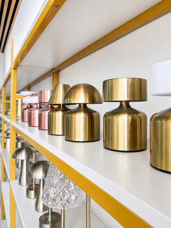 Finished decorative lighting supported by custom metal hardware