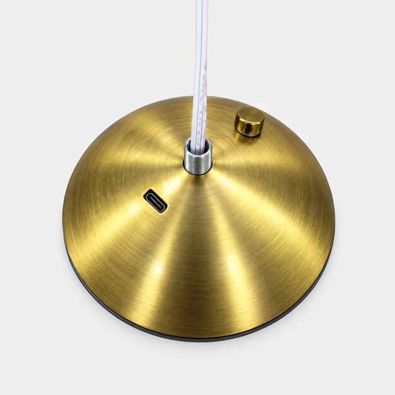 Metal cover installation during rechargeable table lamp assembly