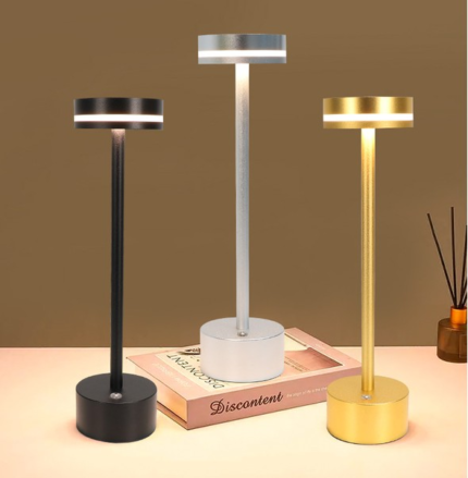 Side-emitting ring glow cordless table lamp with solid aluminum body