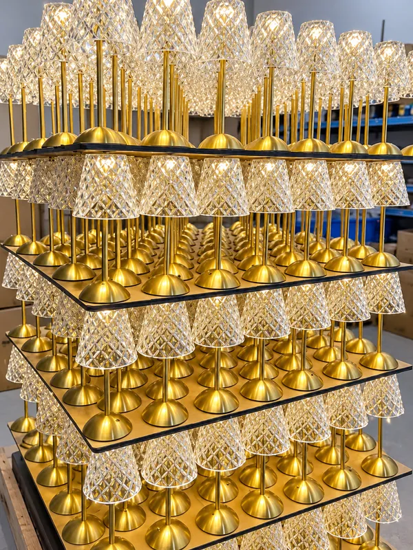 Lamp aging test racks for rechargeable lighting quality control