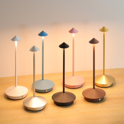 Cone cordless ambient lamp with heavy iron base on restaurant table